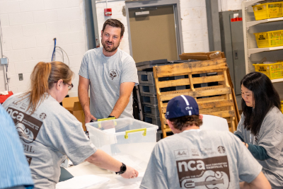 NCA attendee volunteers at in Nashville, 2024