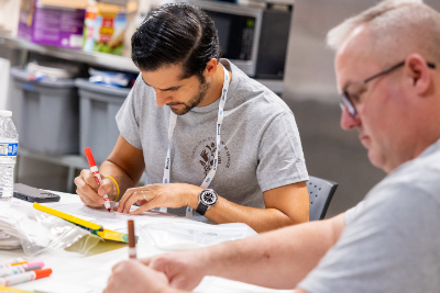 NCA volunteers write letters with markers, 2024 volunteer project, Nashville